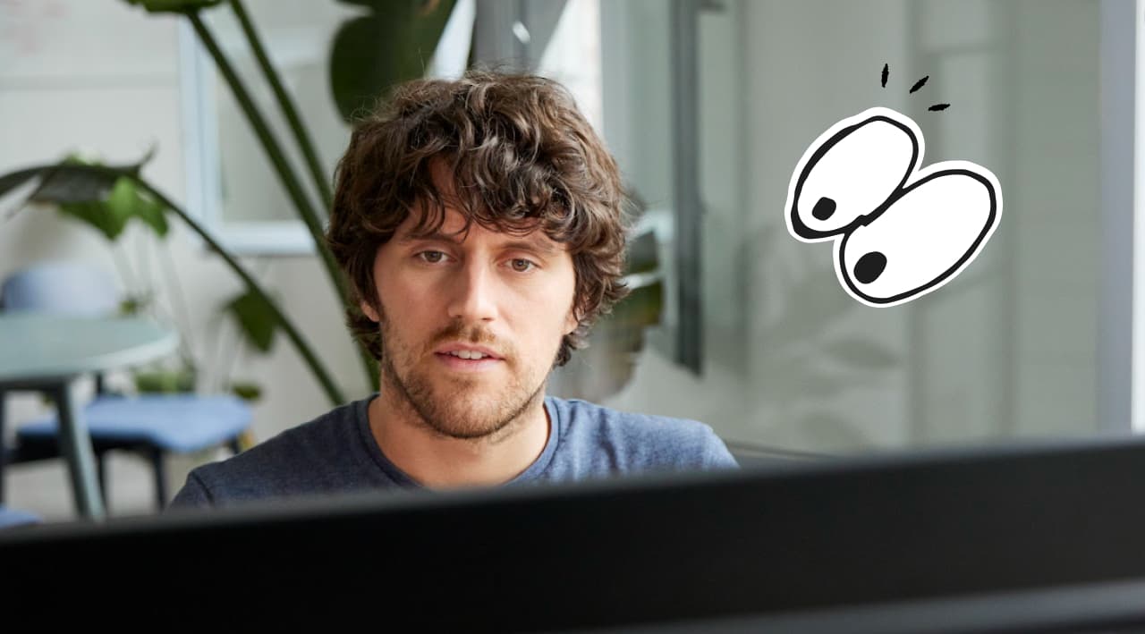 Frontales Portrait von arbeitender Person mit illustrierten Augen, die die Person anschauen